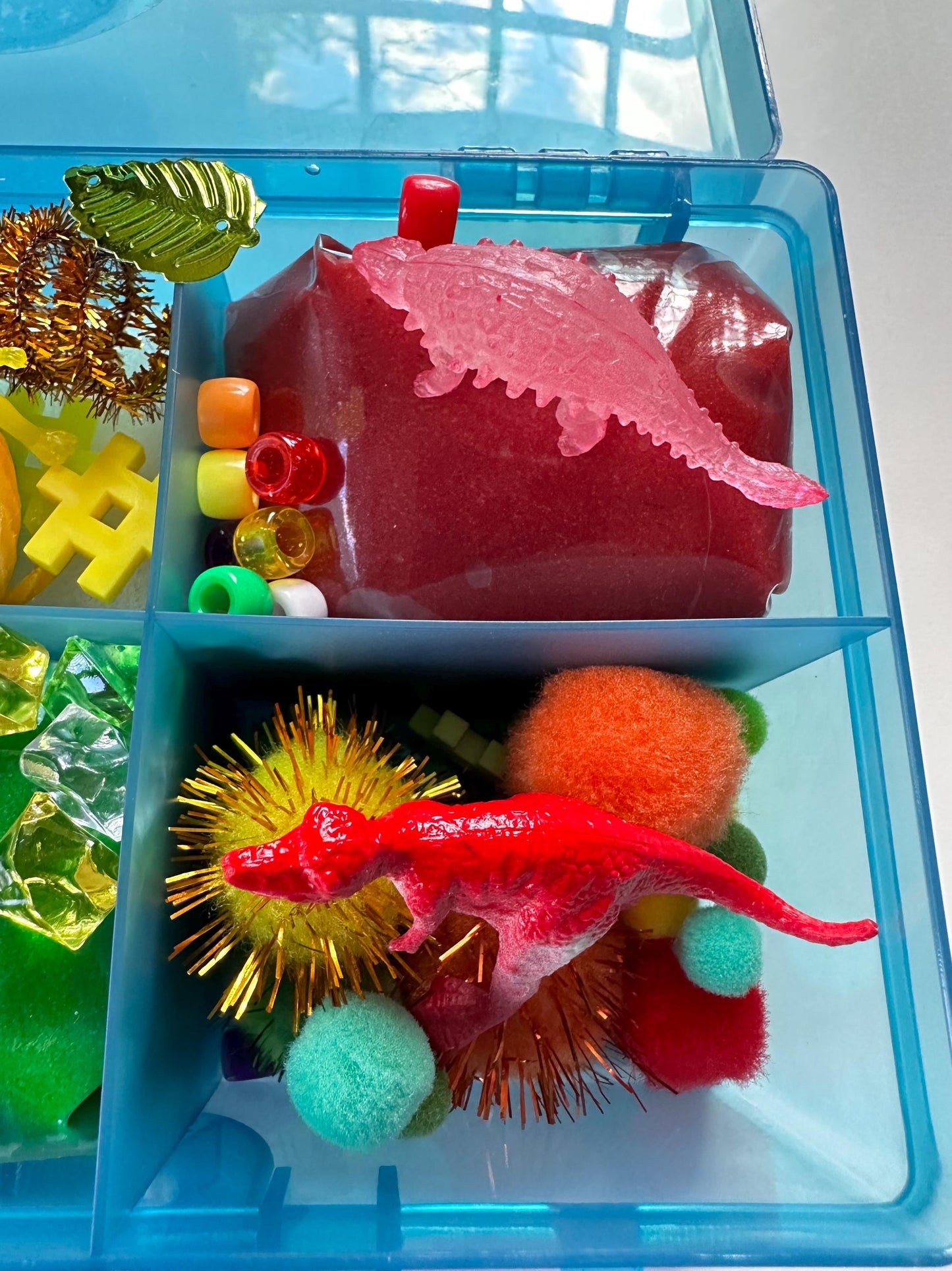 Dinosaur playdough sensory box